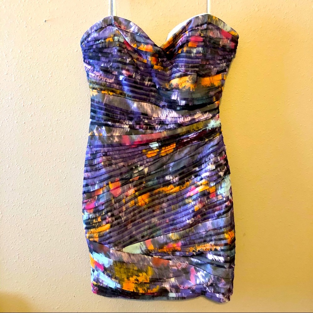 Bombshell mini strapless dress with artistic flare
